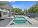 A stunning backyard pool with lounge area and mature landscaping at 222 N Clearview Ave, Tampa, FL 33609