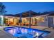 Backyard featuring a pool, lounge area, dining set, and modern outdoor lighting at 222 N Clearview Ave, Tampa, FL 33609