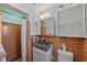 Bathroom featuring tile walls and a stone basin sink at 222 N Clearview Ave, Tampa, FL 33609