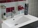 Bathroom vanity featuring a sleek, modern faucet and elegant decor at 222 N Clearview Ave, Tampa, FL 33609