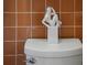 Funky bathroom decor featuring a modern art statue on top of the toilet at 222 N Clearview Ave, Tampa, FL 33609
