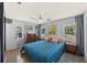 Cozy bedroom with natural light, stylish decor and a fan at 222 N Clearview Ave, Tampa, FL 33609