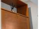 Built-in wooden cabinet with unique hardware and top shelf with decorative diffuser at 222 N Clearview Ave, Tampa, FL 33609