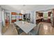 Dining room with modern lighting, refinished terrazzo floors, an open floorplan, and a view of the kitchen at 222 N Clearview Ave, Tampa, FL 33609