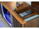 An entertainment center features a bar with illuminated wine glass storage and vintage controls at 222 N Clearview Ave, Tampa, FL 33609