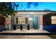Charming home featuring a modern teal door and a well-maintained brick facade at 222 N Clearview Ave, Tampa, FL 33609