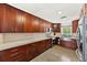 Gourmet kitchen with granite countertops and stainless steel appliances and spacious cabinets at 222 N Clearview Ave, Tampa, FL 33609