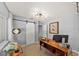 Bright office with barn door and a modern ceiling light fixture, perfect for a productive work environment at 222 N Clearview Ave, Tampa, FL 33609