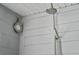 Outdoor shower with rainfall head and handheld sprayer in a grey plank surround at 222 N Clearview Ave, Tampa, FL 33609