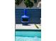 Blue fireplace by the pool with modern blue fence at 222 N Clearview Ave, Tampa, FL 33609
