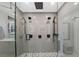 Modern shower with multiple shower heads and glass enclosure at 222 N Clearview Ave, Tampa, FL 33609