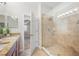 Bathroom with a granite vanity, tile flooring, and glass shower at 2527 Silverback Ct, Palm Harbor, FL 34684