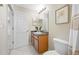 Bathroom featuring a granite vanity, framed mirror, and decor at 2527 Silverback Ct, Palm Harbor, FL 34684