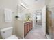 Bathroom with granite vanity, tile flooring, and bright lighting at 2527 Silverback Ct, Palm Harbor, FL 34684