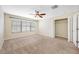 Bedroom featuring carpet flooring, a ceiling fan, and a walk-in closet at 2527 Silverback Ct, Palm Harbor, FL 34684