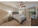 Bright bedroom features a large bed and two windows at 2527 Silverback Ct, Palm Harbor, FL 34684