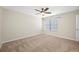 Bedroom featuring neutral walls, carpet flooring, a ceiling fan, one window with blinds, and white trim at 2527 Silverback Ct, Palm Harbor, FL 34684
