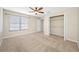 Bedroom featuring a closet with shelving and a window at 2527 Silverback Ct, Palm Harbor, FL 34684