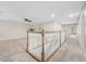 Open upstairs hallway with staircase, views of the bedroom and hallway at 2527 Silverback Ct, Palm Harbor, FL 34684