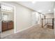 Upstairs hallway featuring tile flooring and access to bathroom at 2527 Silverback Ct, Palm Harbor, FL 34684