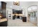 Modern kitchen boasts stainless appliances, dark cabinets, granite counters, and adjoining breakfast area at 2527 Silverback Ct, Palm Harbor, FL 34684
