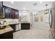 Charming eat-in kitchen featuring stainless steel appliances, tile backsplash, and adjoining dining area at 2527 Silverback Ct, Palm Harbor, FL 34684