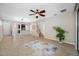 Bright living space with tile flooring, staircase, and smooth transition to the kitchen at 2527 Silverback Ct, Palm Harbor, FL 34684