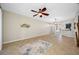 Spacious living room featuring ceiling fan and neutral tile flooring, perfect for gatherings at 2527 Silverback Ct, Palm Harbor, FL 34684