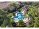 Aerial view of a community pool featuring a gazebo and well-maintained landscaping for outdoor enjoyment at 2527 Silverback Ct, Palm Harbor, FL 34684