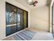 Indoor-outdoor living is on display as the screened-in patio shows tile flooring and a ceiling fan for comfort at 2527 Silverback Ct, Palm Harbor, FL 34684