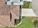 Overhead view of a well-maintained home with a detailed driveway and lush greenery at 2602 Novack Ct, Sun City Center, FL 33573