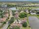Community aerial showcasing landscaping, lakes, golf course and beautiful residential streets at 2602 Novack Ct, Sun City Center, FL 33573