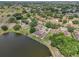 Aerial view of property featuring lakefront backyard and manicured community at 2602 Novack Ct, Sun City Center, FL 33573