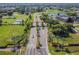 Aerial view of community entrance, showcasing landscaped streets and community features at 2602 Novack Ct, Sun City Center, FL 33573
