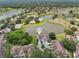 Community aerial view highlighting waterfront homes, natural scenery, and peaceful surroundings at 2602 Novack Ct, Sun City Center, FL 33573