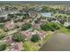 Residential aerial view of the community with golf course, waterways, and community pool at 2602 Novack Ct, Sun City Center, FL 33573