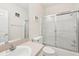 Clean bathroom with a glass-door shower and modern vanity at 2602 Novack Ct, Sun City Center, FL 33573