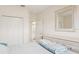 Spacious bedroom with large closet, stylish dresser, and view to the bathroom at 2602 Novack Ct, Sun City Center, FL 33573