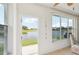 Sunroom with windows and lake views at 2602 Novack Ct, Sun City Center, FL 33573