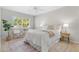 Bright bedroom features a ceiling fan, cozy furniture, and a window with natural light at 300 22Nd S Ave, St Petersburg, FL 33705