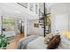 Bedroom with spiral staircase, hardwood floors, and sliding glass door closet at 300 22Nd S Ave, St Petersburg, FL 33705