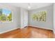 Bedroom with hardwood floors, two windows, and white trim at 300 22Nd S Ave, St Petersburg, FL 33705