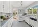 Charming kitchen with vintage tile, white cabinets, and a bright atmosphere for cooking and gathering at 300 22Nd S Ave, St Petersburg, FL 33705
