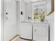 Laundry room featuring a washer and dryer and a small window at 300 22Nd S Ave, St Petersburg, FL 33705