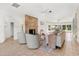 Open-concept living space featuring a stone fireplace, modern seating, and large windows for ample light and views at 300 22Nd S Ave, St Petersburg, FL 33705