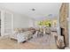Bright living room featuring a cozy fireplace, stylish furniture, and a seamless transition to the outdoors at 300 22Nd S Ave, St Petersburg, FL 33705