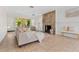 Comfortable living room showcasing a stone fireplace, neutral décor, and views of the landscaped backyard at 300 22Nd S Ave, St Petersburg, FL 33705