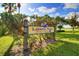 Lassing Park sign showing the city of St. Petersburg near lush greenery on a sunny day with a blue sky at 300 22Nd S Ave, St Petersburg, FL 33705