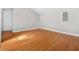 Empty room featuring hardwood floors, light gray walls, and minimal interior design at 300 22Nd S Ave, St Petersburg, FL 33705
