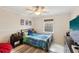 Comfortable bedroom with playful decor, a bed, and a large television at 3176 Duane Ave, Oldsmar, FL 34677